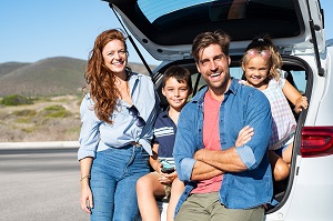 family sitting inside suv