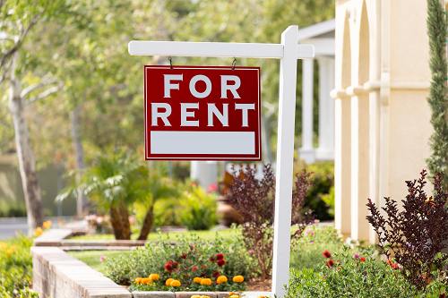 a for rent sign in a front yard
